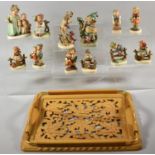 A Collection of Goebel and Other Continental Ornaments of Children on Pierced Tray