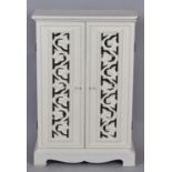 A White Painted Shelved Cupboard with Pierced Panelled Doors, 45cm wide