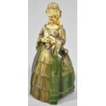 An Early/Mid 20th Century Spelter Novelty Table Lighter in the Form of Crinoline Lady with Puppy,