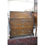 A 19th Century Oak Fall Front Bureau with Fitted Interior Having Nine Drawers, Eleven Pigeon Holes