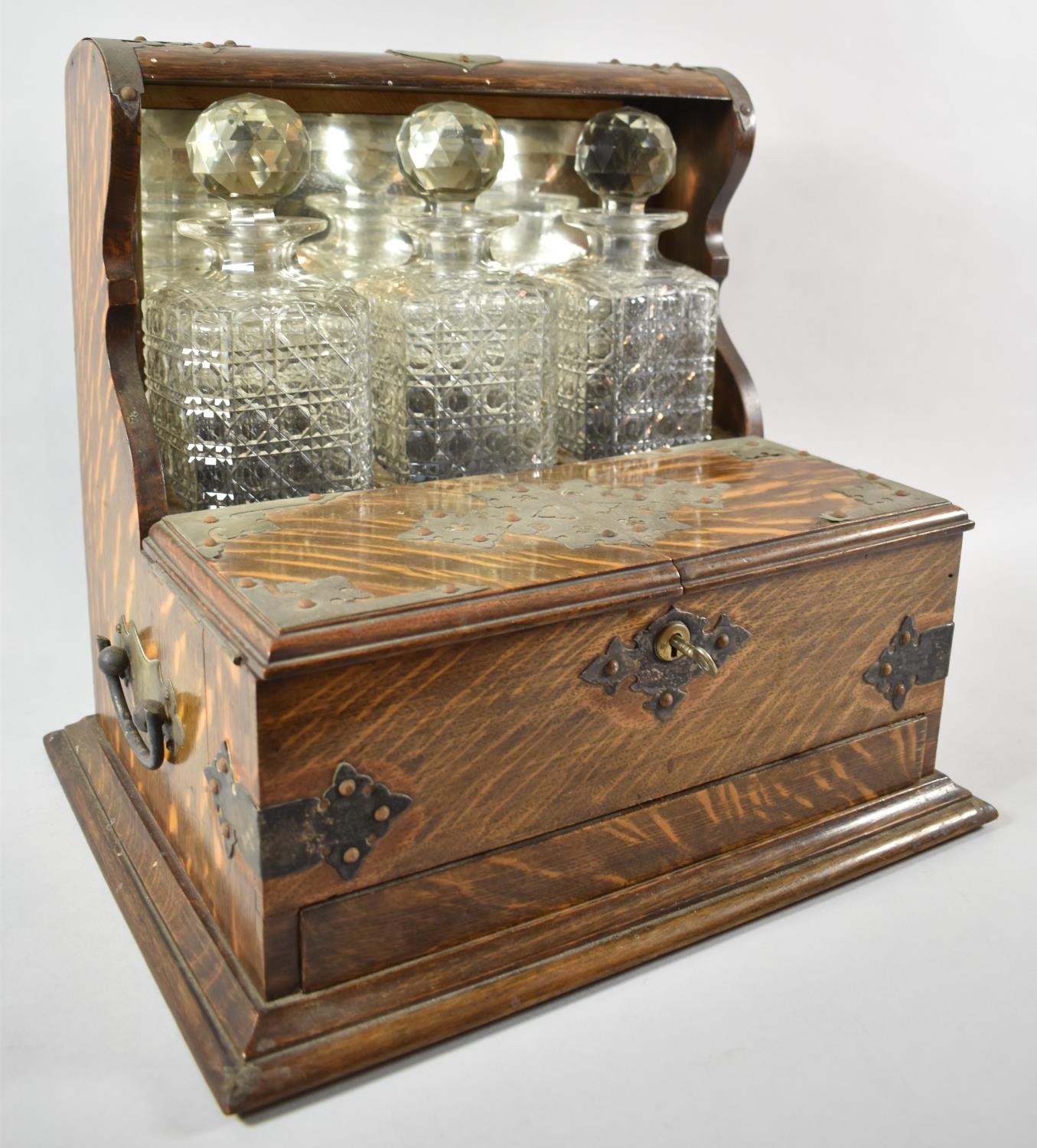 A Late 19th Century Silver Plate Mounted Three Bottle Games Tantalus with Hinged Lid to Games