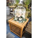 A Modern Bamboo Conservatory Coffee Table Together with a Reproduction Wire Bird Cage Containing