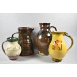 A Collection of Four Various Glazed Stoneware Studio Pottery Jugs, the Largest 30cm high