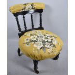 An Edwardian Ebonised Spindle Back Ladies Nursing Chair with Circular Seat