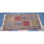 A Patterned Woollen Hearth Rug, 120x64cm