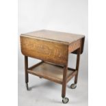 An Edwardian Oak Drop Leaf Trolley with Single End Drawer