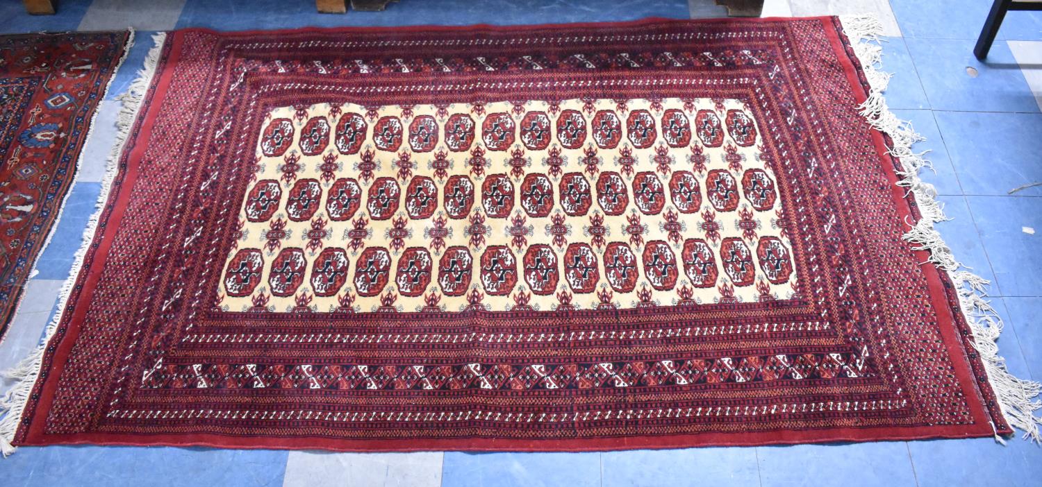 A Patterned Rug on Red Ground, 195x133cm