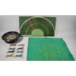 A Roulette Wheel and Mat and a Racing Board Game with Metal Horses and Jockeys