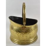 A Brass Helmet Shaped Coal Scuttle