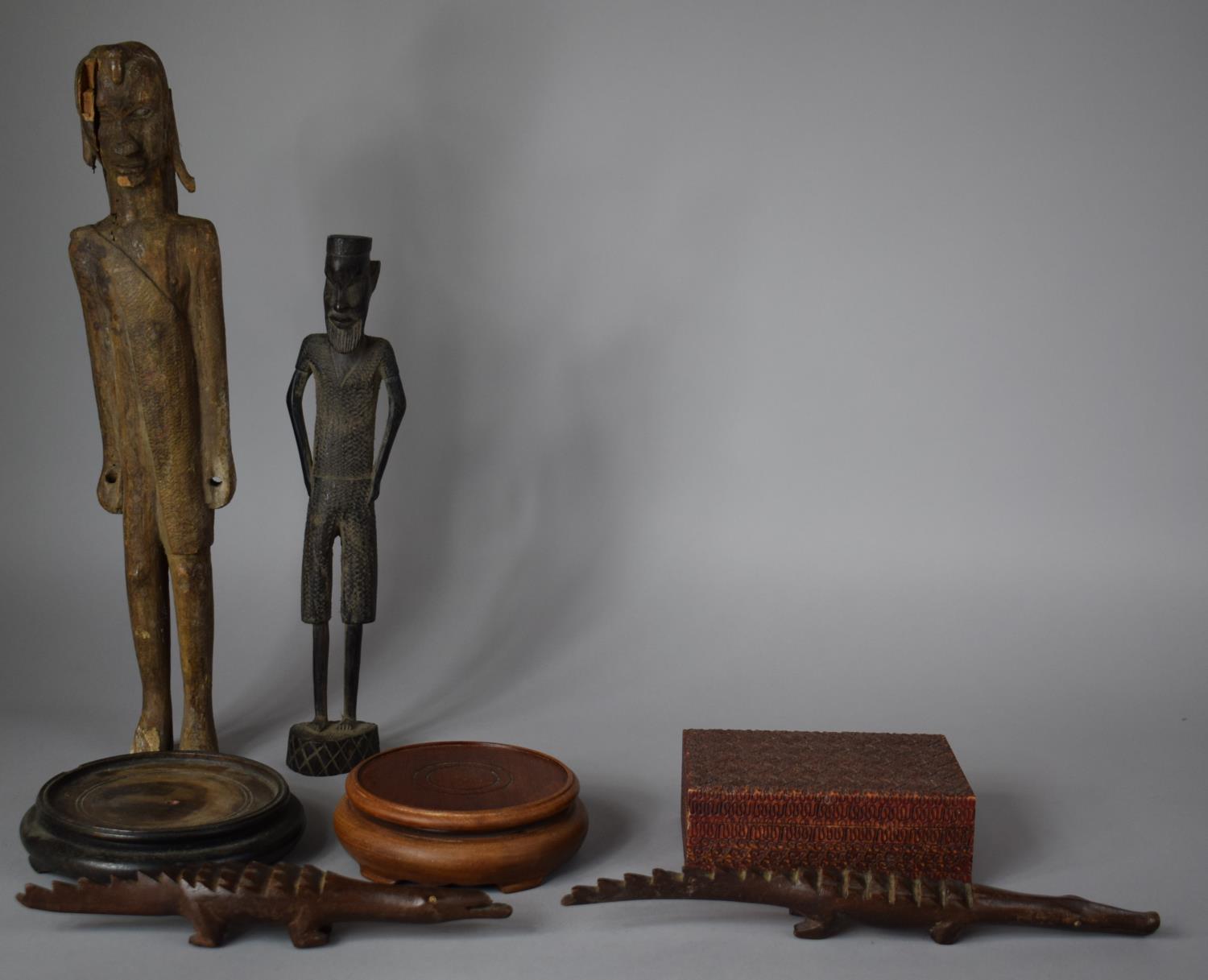 A Collection of Carved Wooden Tribal and Souvenir Ornaments, Two Oriental Stands and a Wooden