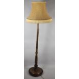 An Edwardian Turned Standard Lamp on Circular Base, With Shade