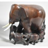 A Moulded Resin Study of Elephants and Calves, 15cm high