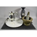 A Carved Granite Pestle and Mortar, Slate Two Handled Tray, Polished and Etched Stoneware Vase,