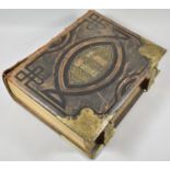 A Brown's Self Interpreting Bible with Tooled Leather Binding Having Gilt Metal Clasps, 33cm high