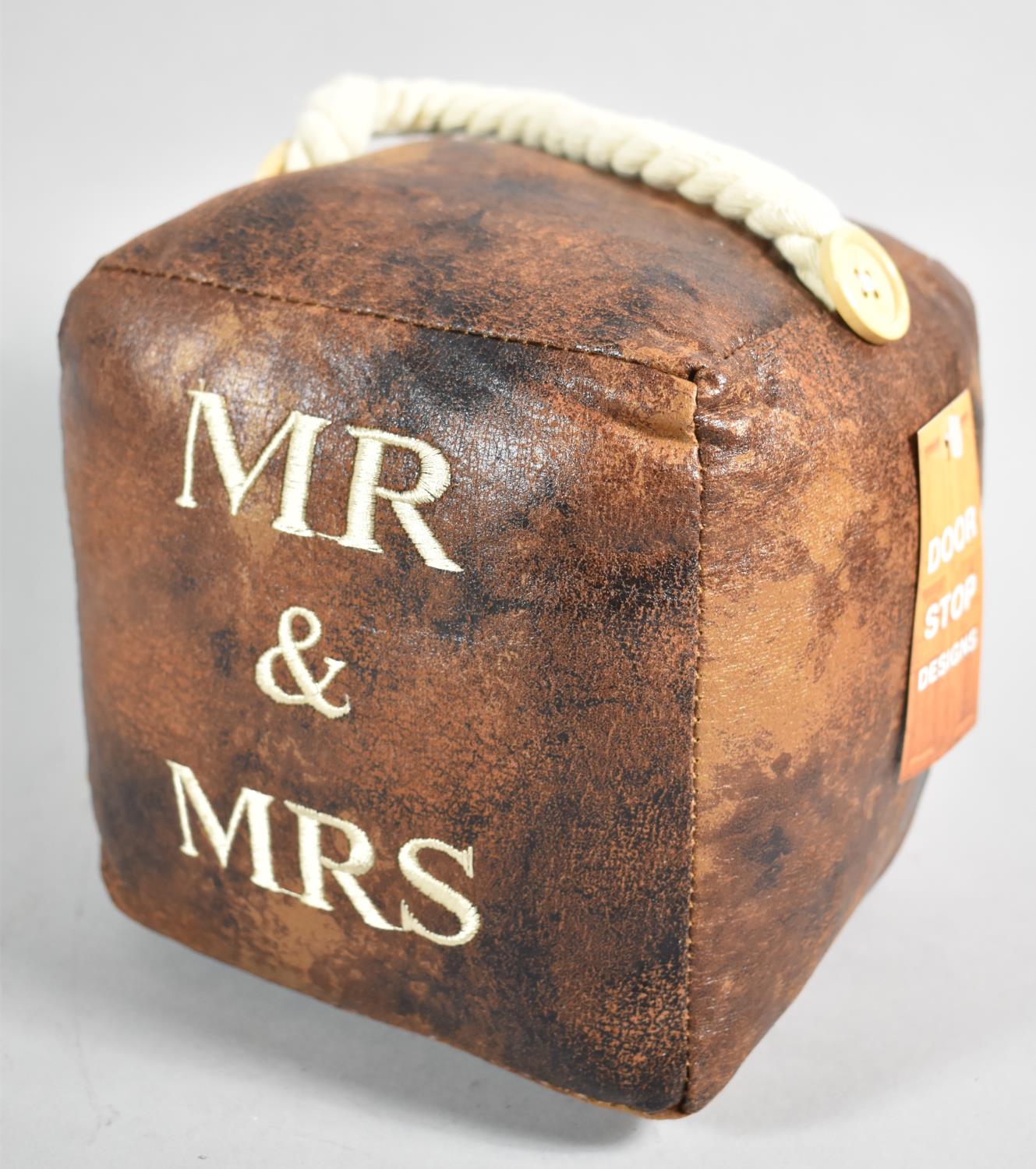 A New and Unused Leather Door Stop Inscribed "Mr & Mrs", 16cm Cube