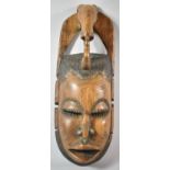 A Carved Souvenir African Tribal Mask, 47cm high