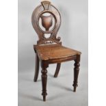 A Victorian Oak Shield Back Hall Chair