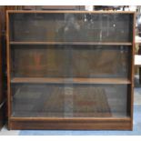 A Mid 20th Century Glazed Three Shelf Bookcase with Sliding Doors, 91cm wide