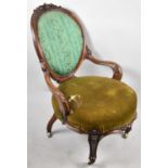 A Victorian Walnut Framed Ladies Balloon Back Ladies Armchair with Circular Seat