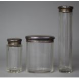 Three Silver Topped Glass Dressing Table Pots