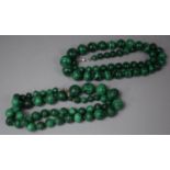 Two Strings of Hand Cut Malachite Spherical Beads of Graduated Size with Glass Bead Spacers