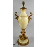 A Large Continental Gilt Metal and Alabaster Vase Shaped Table Lamp with Two Handles and Dolphin