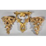A Pair of Moulded Gilt Composition Wall Sconces, Together with a Single Wooden Example, 25cm High