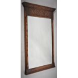 An Edwardian Oak Framed Wall Mirror with Carved Top Rail, 58cm Wide and 93cm high