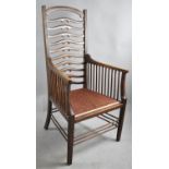 An Edwardian Ladder Back Armchair with Spindle Supports