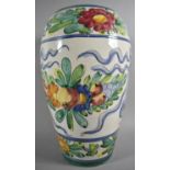 A Continental Glazed Ovoid Vase Decorated in Coloured Enamels with Fruit and Flowers, 42cm high