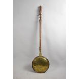 A 19th Century Brass Bed Warming Pan with Turned Wooden Handle