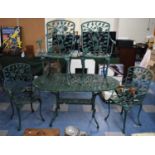 A Cast Metal Patio Set Comprising Oval Table, 137cm Wide and Four Arm Chairs