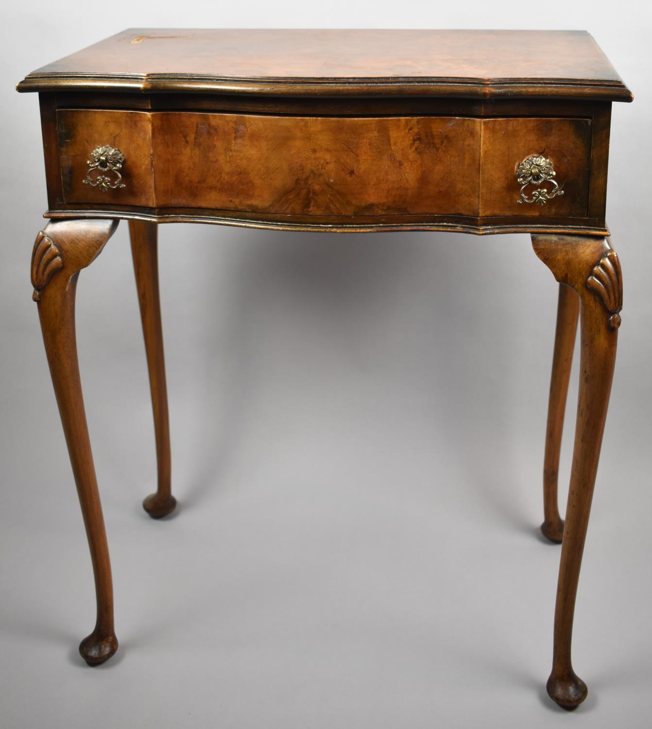 An Edwardian Walnut Serpentine Front Side Table with Single Long Drawer on Extended Cabriole