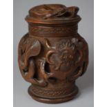 A Carved Indonesian Wooden Tobacco/Caddy Box Decorated in High Relief with Dragons, 17cm high