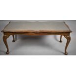 A Modern Walnut Rectangular Coffee Table on Short Cabriole Supports, 107cm Wide