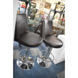 A Pair of Chrome Based Rise and Fall Circular Seated Swivel Stools