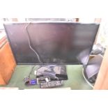 A Samsung 42"Flat Screen TV with Remote