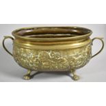 An Oval Brass Planter with Repousse Decoration of Grapes and Vine Leaves, 30.5cm wide