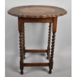 An Edwardian Oak Oval Topped Occasional Table on Barley Twist Supports with Carved Border