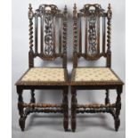 A Pair of Oak Gothic Revival Armchairs with Pierced Splats and Barley Twist Supports