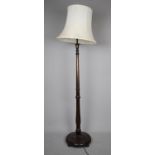 A Mid 20th Century Oak Standard Lamp and Shade