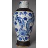 A Chinese Blue and White Nanking Vase Decorated with Dragons, 26cm high