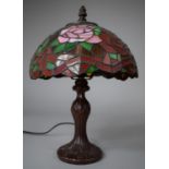 A Reproduction Bronze Effect Table Lamp with Tiffany Style Shade, 35cm high