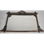 An Ebonised Aesthetic and Gilt Oval Mantle Mirror, 100cm wide