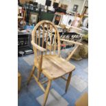 An Ercol Armchair, Somewhat Water Damaged and in Need of Restoration