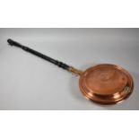 A Copper Bed Warming Pan with Turned Ebonised Handle