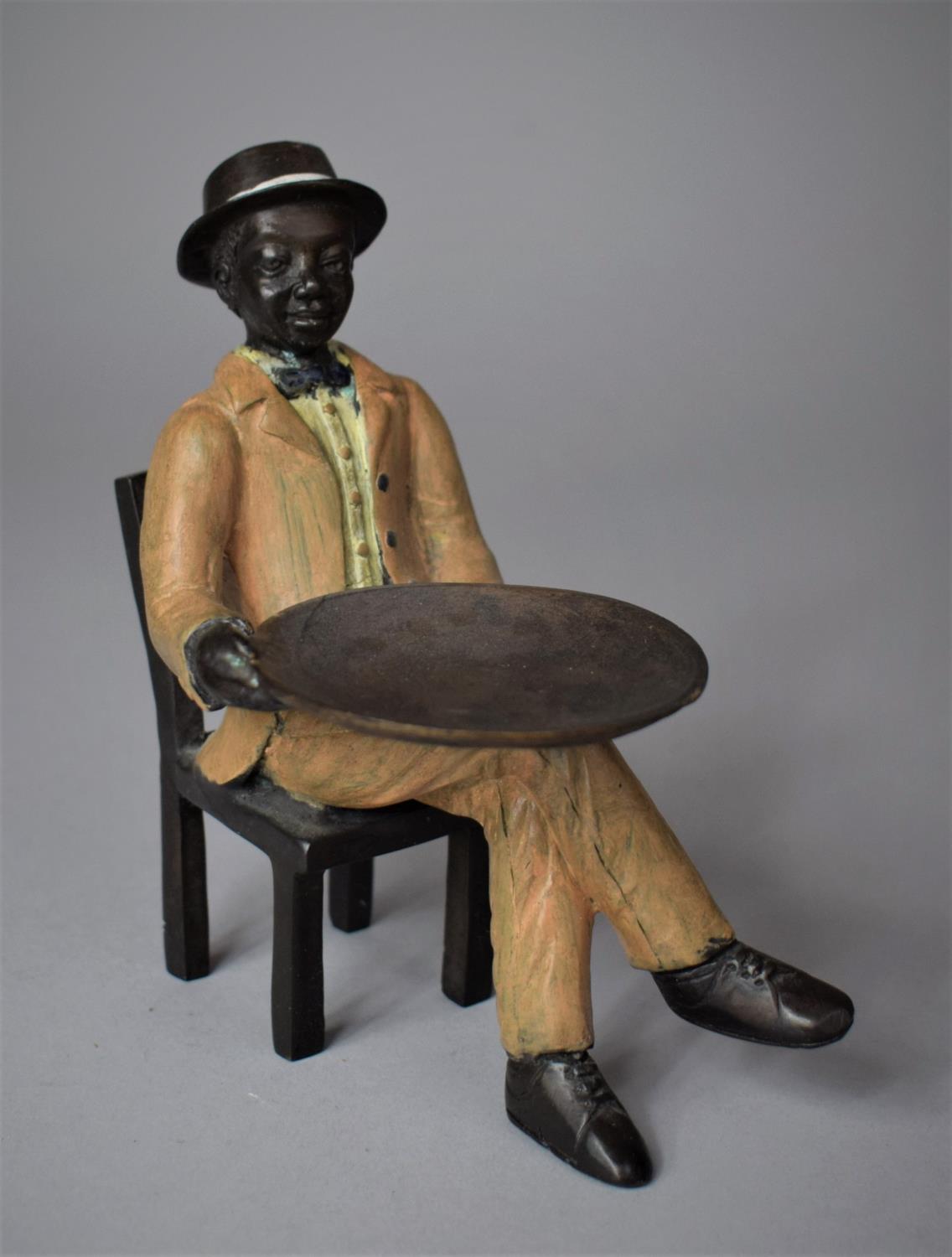 A Reproduction Painted Metal Study of Seated Gent with Tray, 13cm high