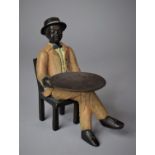 A Reproduction Painted Metal Study of Seated Gent with Tray, 13cm high