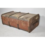 A Vintage Canvas Covered Travelling Trunk with "Luggage in Advance" Labels, 24cm high