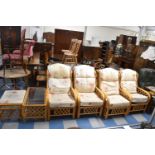 A Set of Four Bamboo Conservatory Armchairs, Rectangular Coffee Table and Footstool